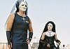 The Sisters of Perpetual Indulgence help at the gates. - Note that they wear boots, too!
