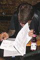 Larry working on the prize list.  We gave - away 36 prizes, including two pair of boots.
