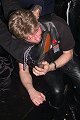 Another bootboy, dogboy (Dan), services the harness boots of his Dad, Jon 

