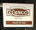 Let's go visit the huge Leather Mart in the lower level of the hotel. - Here we see the large Wesco sign hanging over the Leather Werks booth.
