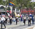 The colors are carried by members of the California Boots and Breeches Corp.
